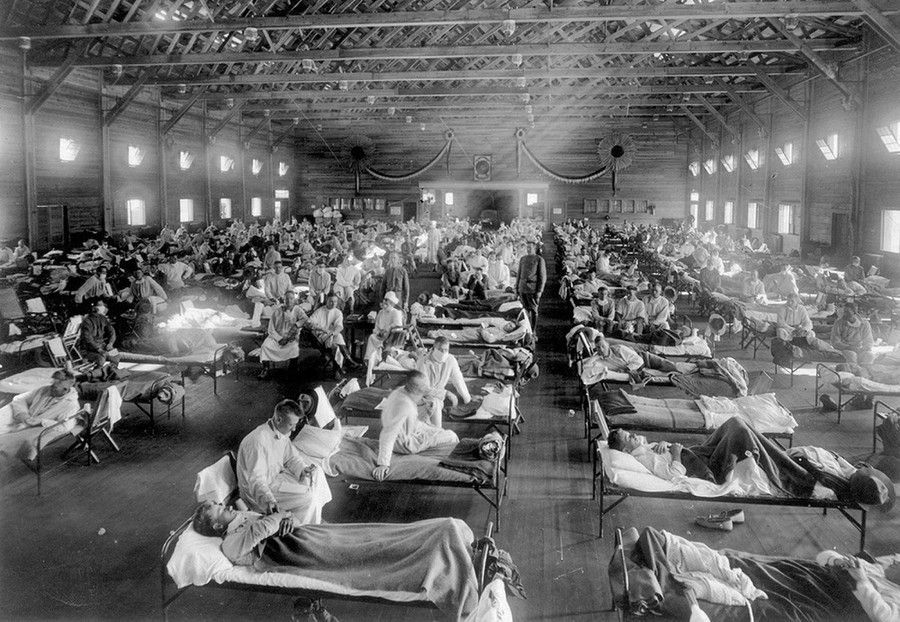 Influenza victims crowd into an emergency hospital near Fort Riley, Kansas in 1918.